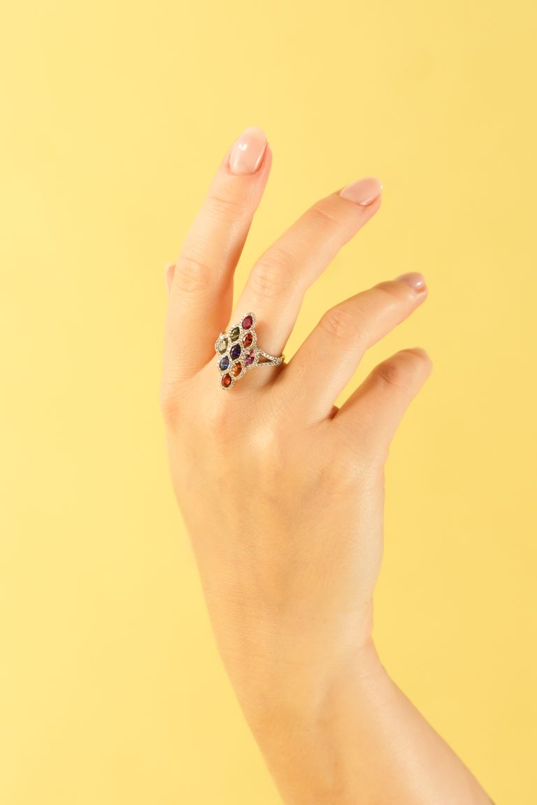 a ring with many colored saphirs